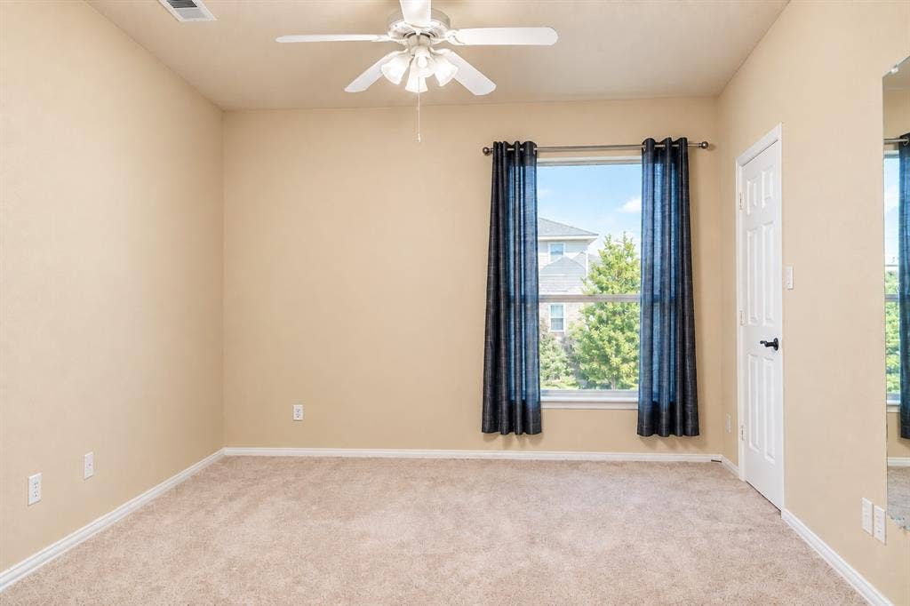 4505 Southgate Drive, Plano, TX 75024 Neutral-toned walls complement plush carpeting