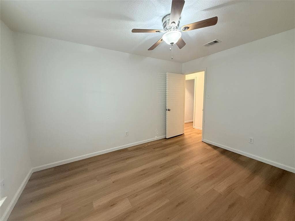 2704 Springlake Court, Irving, TX 75060 Master bedroom. New fans, fresh paint and new flooring.