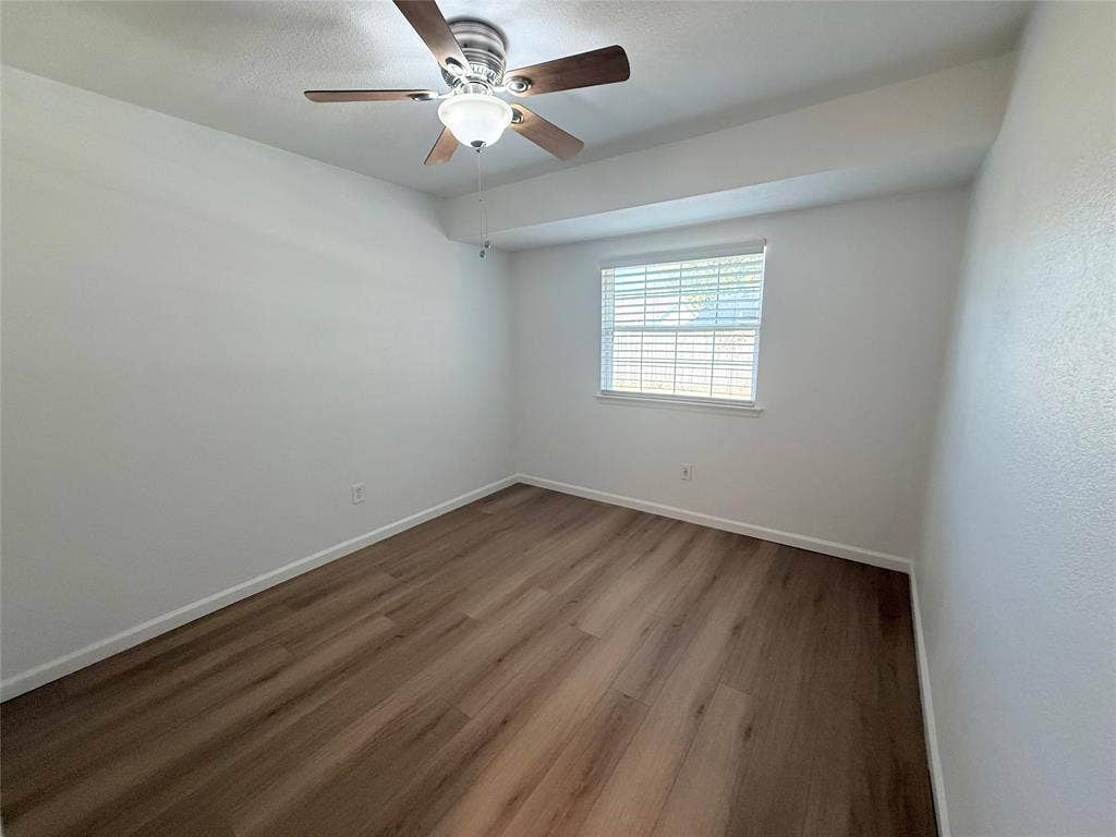 2704 Springlake Court, Irving, TX 75060 Secondary bedroom. Fresh paint and new flooring.