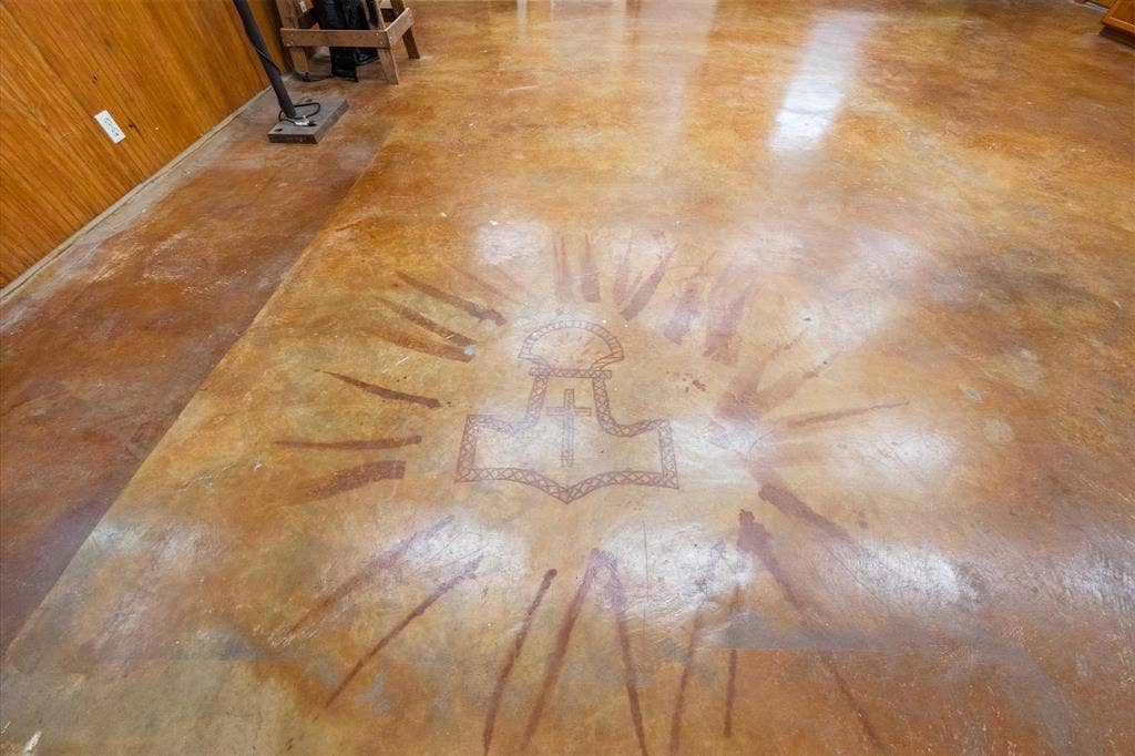 6472 Mark Drive, Burleson, TX 76028 Polished concrete flooring with a distinct central medallion design