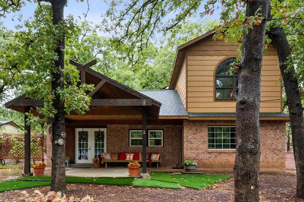 6472 Mark Drive, Burleson, TX 76028 Brick and siding exterior with a covered front porch featuring exposed wood beams