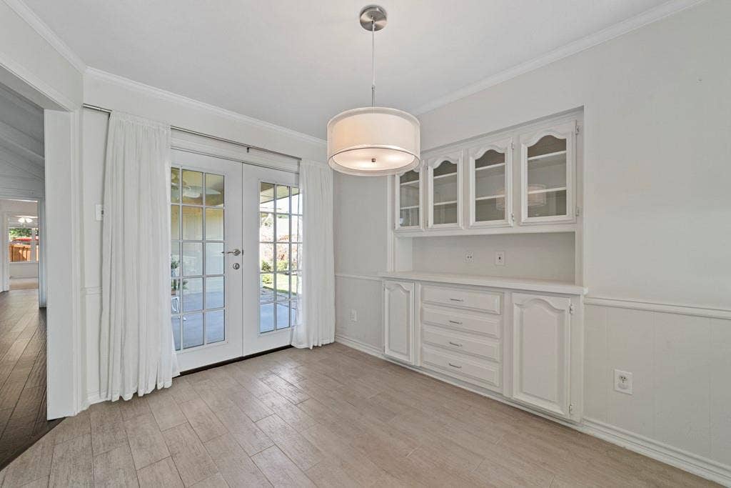 16353 Lauder Lane, Dallas, TX 75248 Built-in cabinetry with glass-front uppers and lower storage