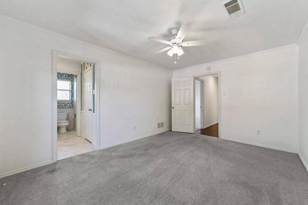 16353 Lauder Lane, Dallas, TX 75248 Carpeted room with white walls, a ceiling fan, and crown molding