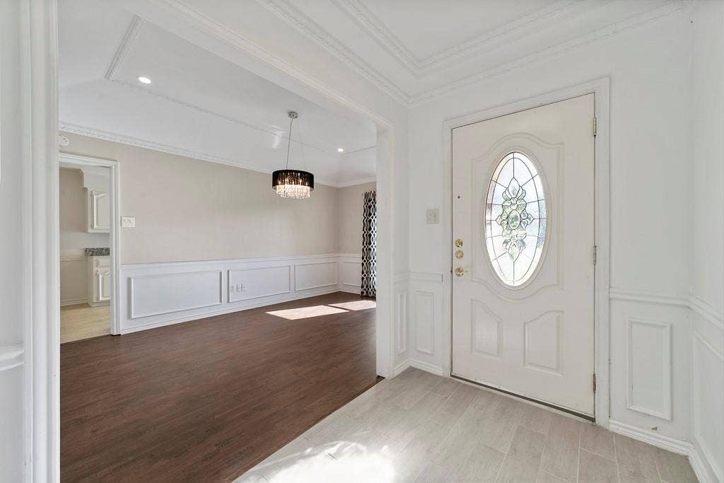 16353 Lauder Lane, Dallas, TX 75248 Entryway featuring a decorative leaded glass door and light grey tile flooring