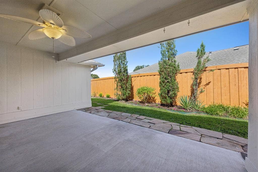 16353 Lauder Lane, Dallas, TX 75248 Covered patio with a ceiling fan, concrete flooring, and a stone walkway