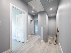 Stair landing is large enough to be an office or play area.