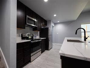 Kitchen appliances include refrigerator, range, microwave, and dishwasher.