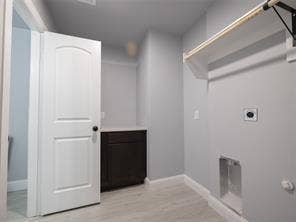 Plenty of room for washer and dryer; hanging rod; and folding cabinet. Half bathroom located inside utility room.