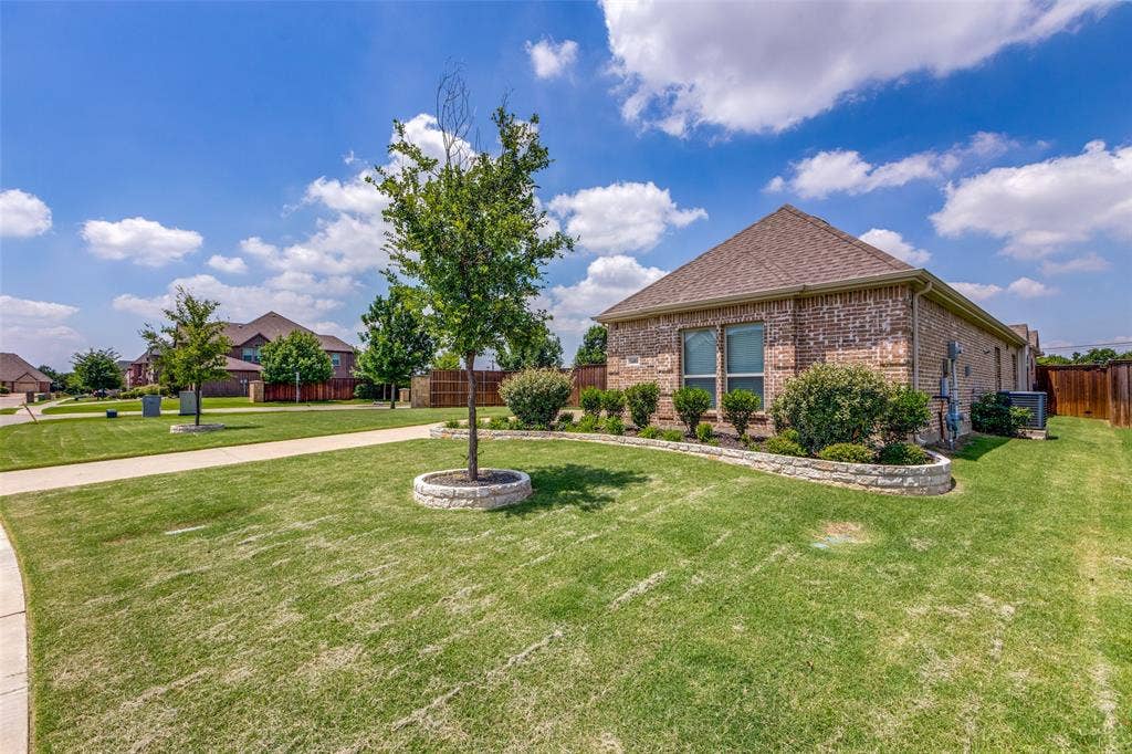 1481 Ramsbury Lane, Prosper, TX 75078 Brick exterior with a gabled roof