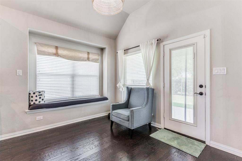 1481 Ramsbury Lane, Prosper, TX 75078 Hardwood-finish flooring, built-in window seating, recessed window, vaulted ceiling, and a full-light exterior door