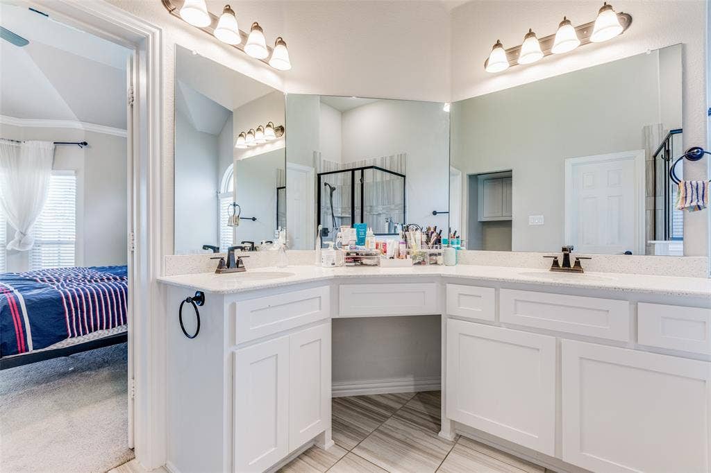 1481 Ramsbury Lane, Prosper, TX 75078 Dual sink vanity with white cabinetry, quartz-finish countertop, and tile flooring