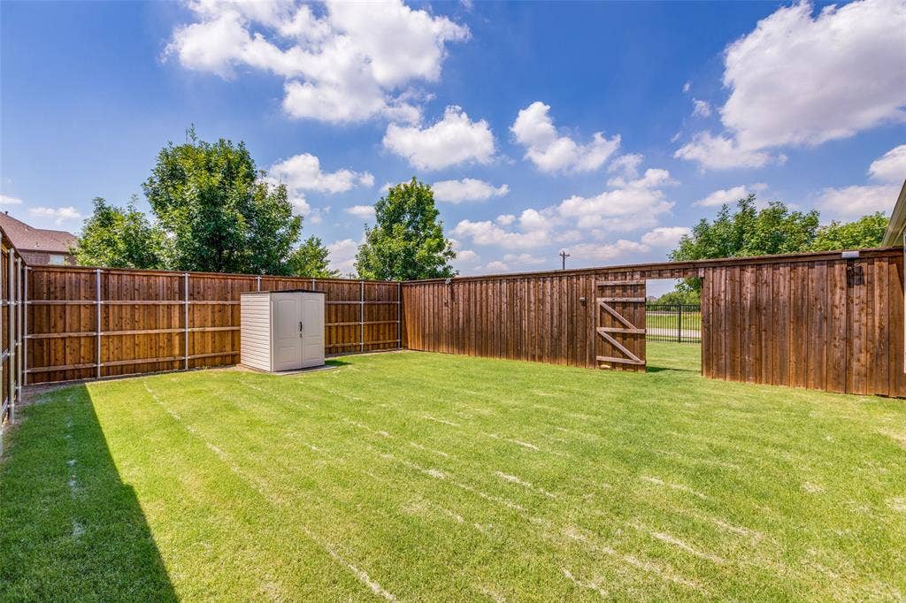 1481 Ramsbury Lane, Prosper, TX 75078 Expansive grass lawn with a full privacy fence