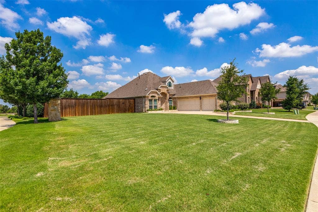 1481 Ramsbury Lane, Prosper, TX 75078 Expansive front lawn with mature trees and a paved walkway
