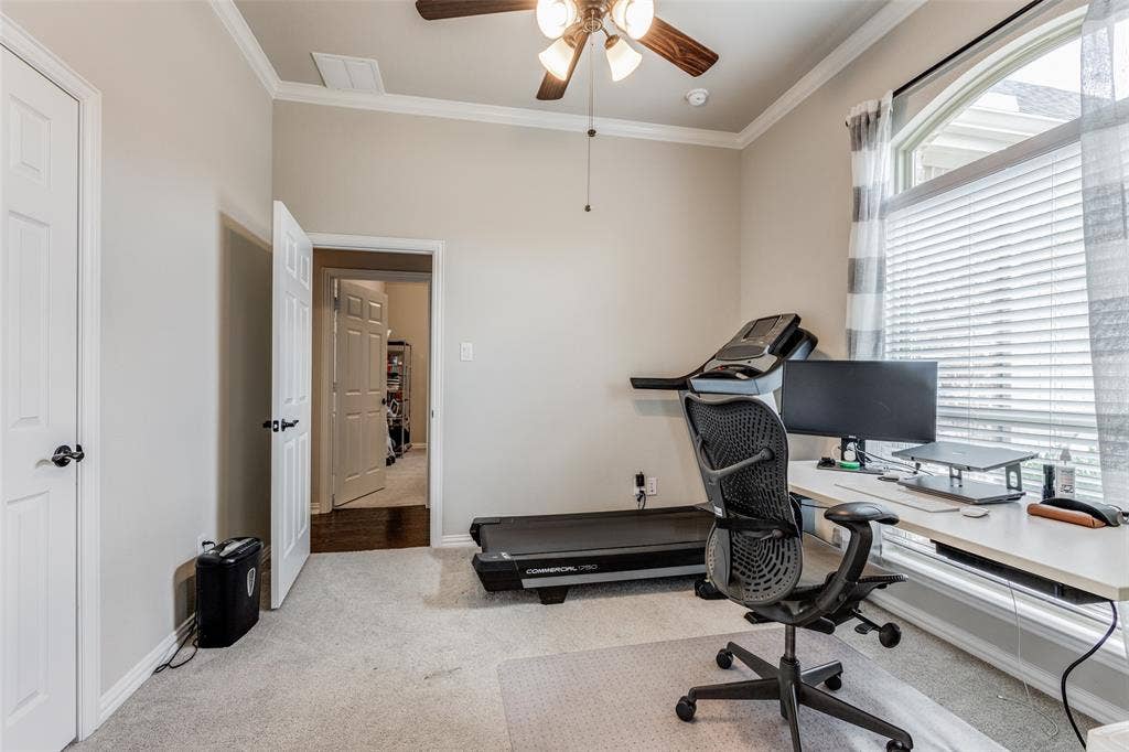 1481 Ramsbury Lane, Prosper, TX 75078 Carpeted room with vaulted ceiling, crown molding, and a ceiling fan