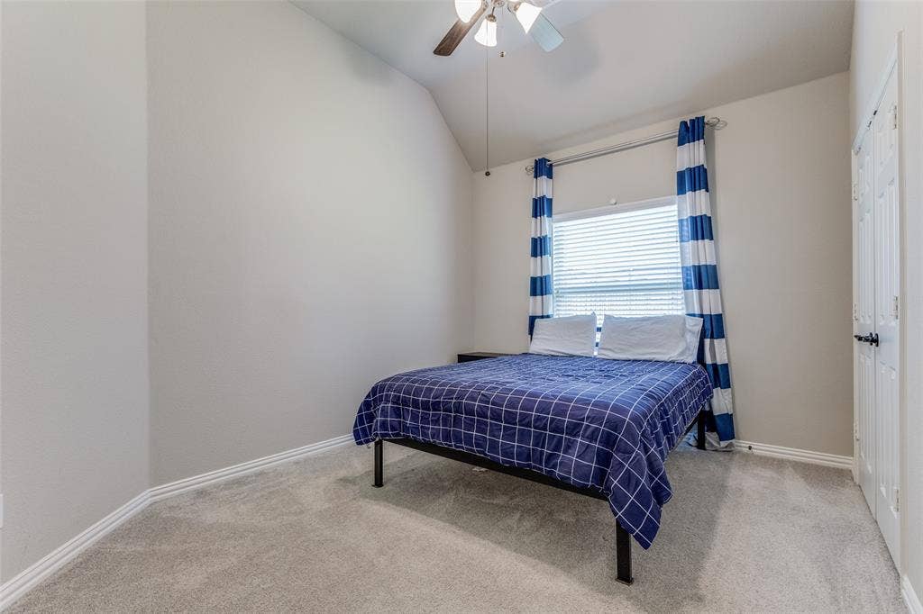 1481 Ramsbury Lane, Prosper, TX 75078 Vaulted ceiling, ceiling fan, window with blinds, light gray wall paint, and light gray carpet