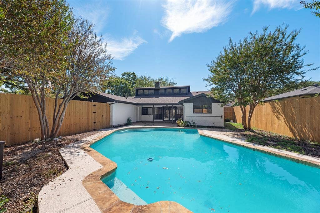 1903 Clemson Drive, Richardson, TX 75081 Outdoor swimming pool with patterned concrete and stone coping