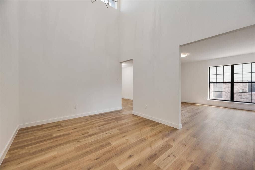 1903 Clemson Drive, Richardson, TX 75081 Soaring ceilings accentuate the open-concept design and wood-finish flooring