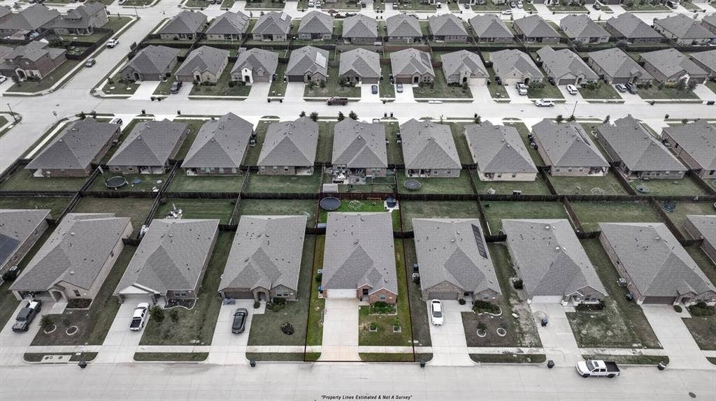 Aerial perspective showcasing a residential community with uniform architectural styles