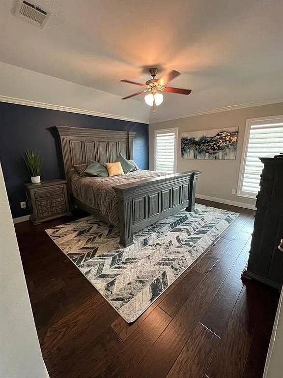 15009 Northview Drive, Little Elm, TX 75068 Wood-finish flooring, crown molding, ceiling fan with integrated lighting, and plantation shutters