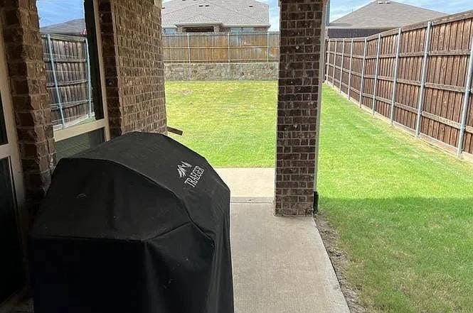 15009 Northview Drive, Little Elm, TX 75068 Covered patio with brick columns and a concrete surface