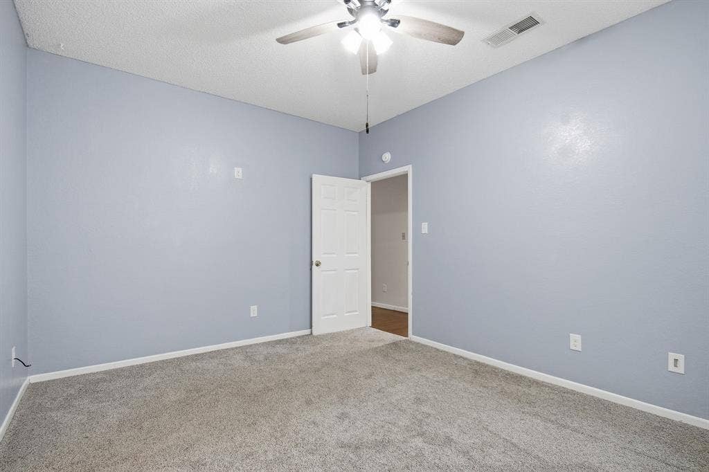 Neutral-toned carpeting throughout