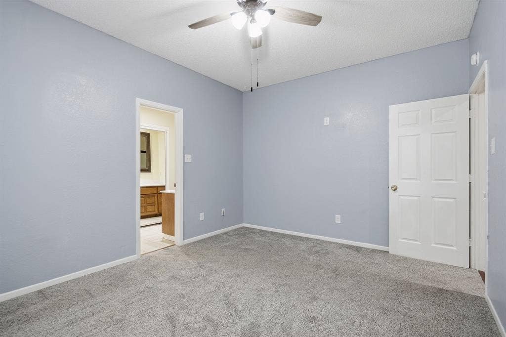 Wall-to-wall carpeting and neutral wall tones