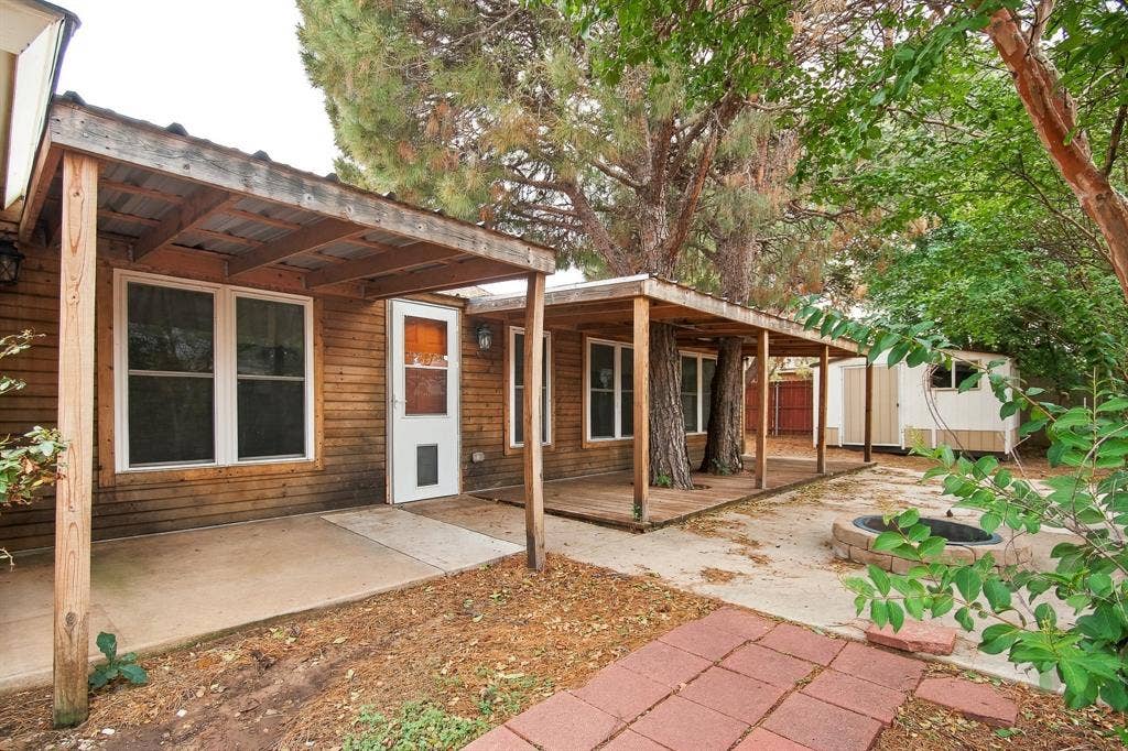 Exterior wood siding with multiple white-framed windows