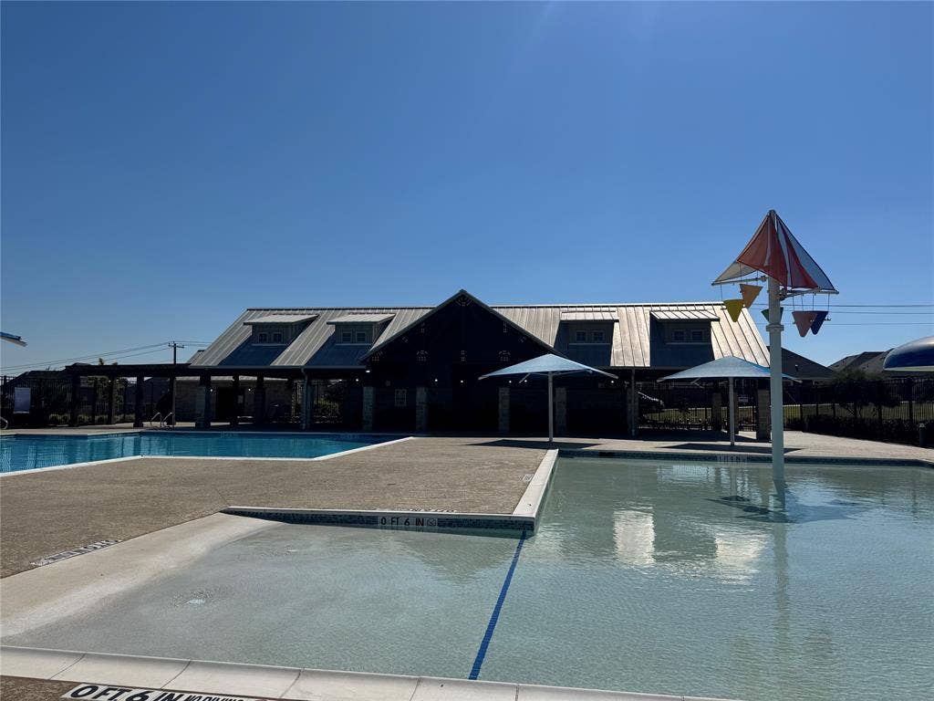 Community pool featuring a patio and a gazebo