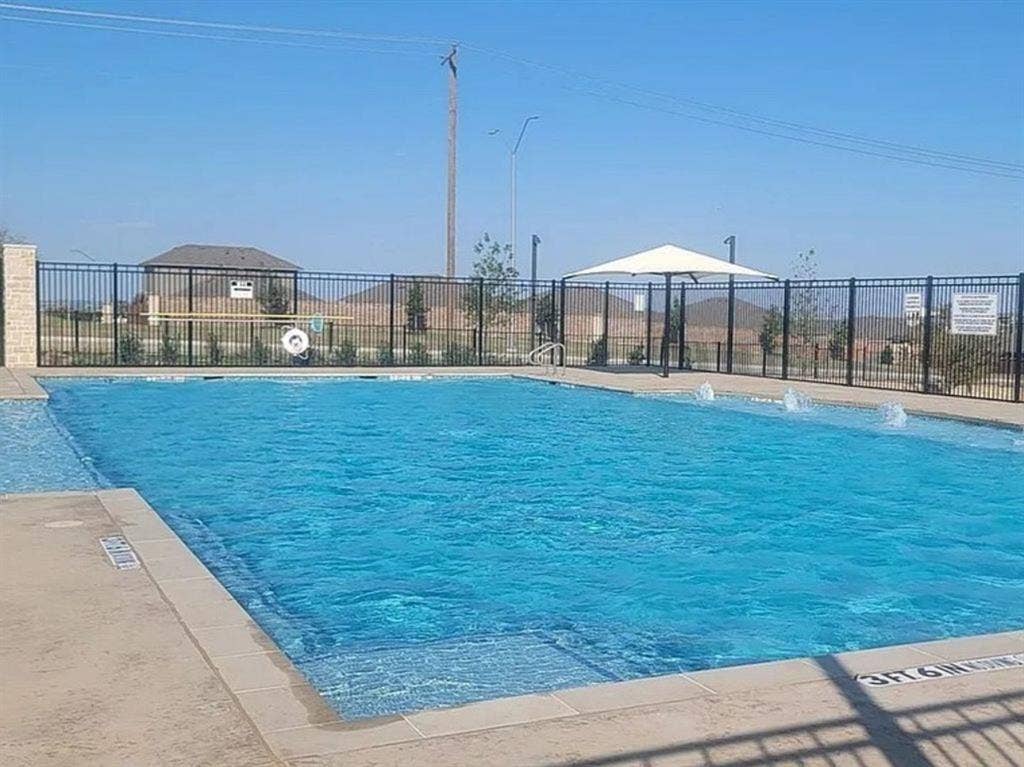 Community pool featuring a patio area