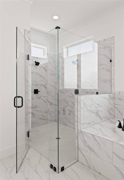 104 Oak Meadow Lane, Weatherford, TX 76085 Walk-in glass shower with matte black hardware, white marble-look wall tile, and a white penny tile shower floor