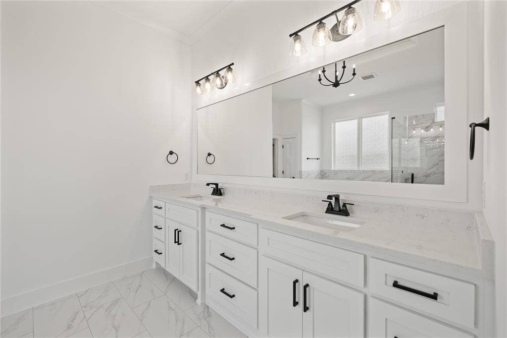 104 Oak Meadow Lane, Weatherford, TX 76085 Dual vanity featuring white cabinetry and countertops