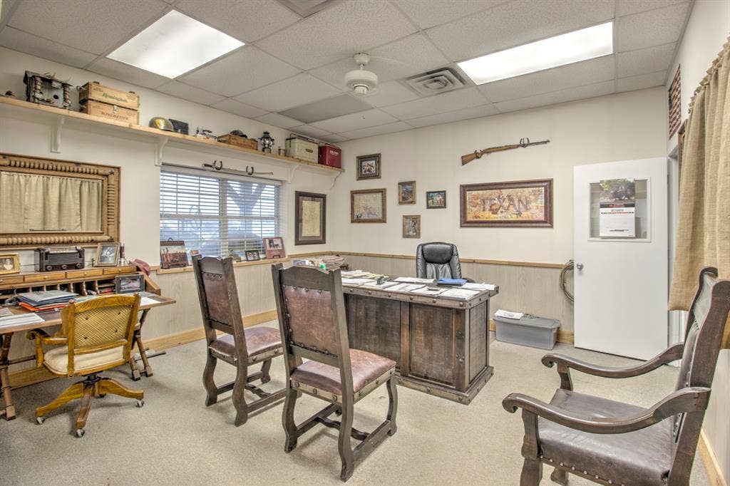 Room featuring wall-to-wall carpeting, wood-finish wainscoting, recessed ceiling lighting, and a window with horizontal blinds