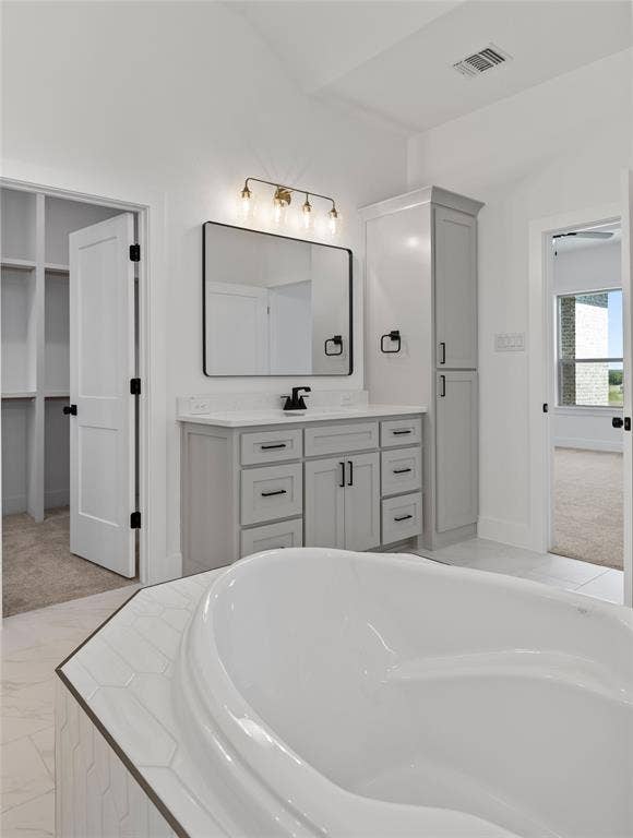 Freestanding bathtub with hexagon tile surround