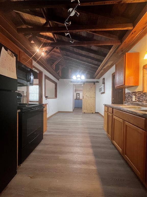 9460 Amy Drive, Hawk Cove, TX 75474 View from kitchen looking toward dining and farm door to laundry