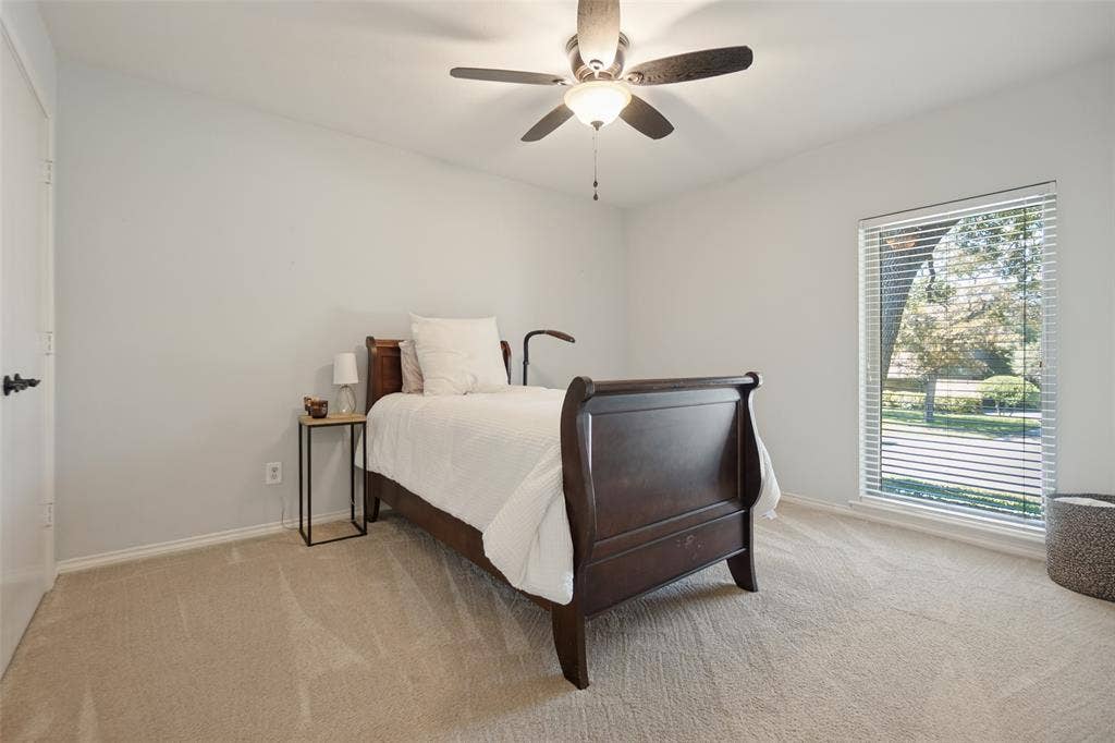 7414 Windmill Lane, Garland, TX 75044 Neutral wall color, carpeted flooring, ceiling fan with integrated lighting, window with blinds