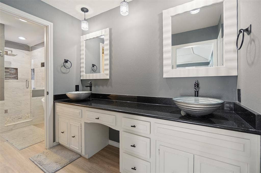 7414 Windmill Lane, Garland, TX 75044 Dual vessel sinks with wall-mounted faucets