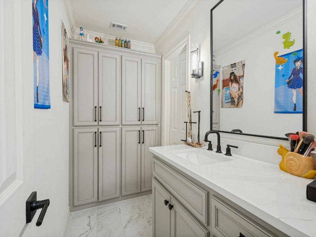 Vanity with an integrated rectangular sink, white countertop, and dark-finish faucet