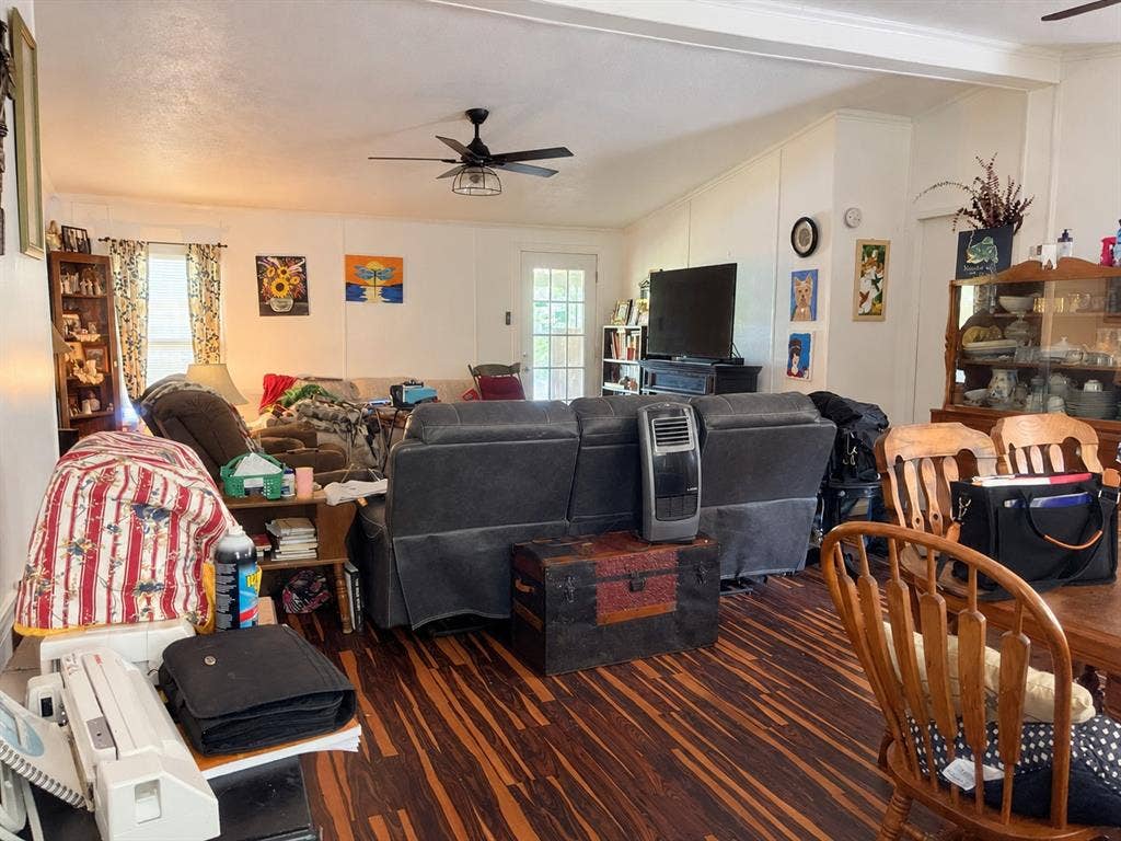 Wood-finish flooring with a ceiling fan light fixture