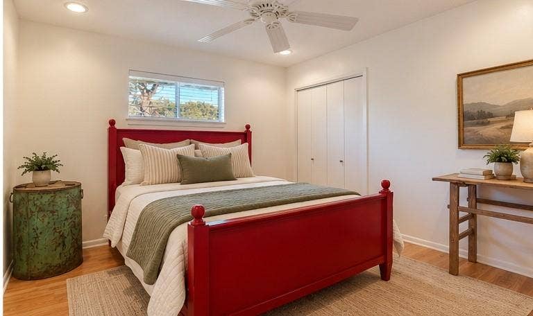 Virtual staged bedding. Light wood-finish flooring, recessed lighting, and a ceiling fan
