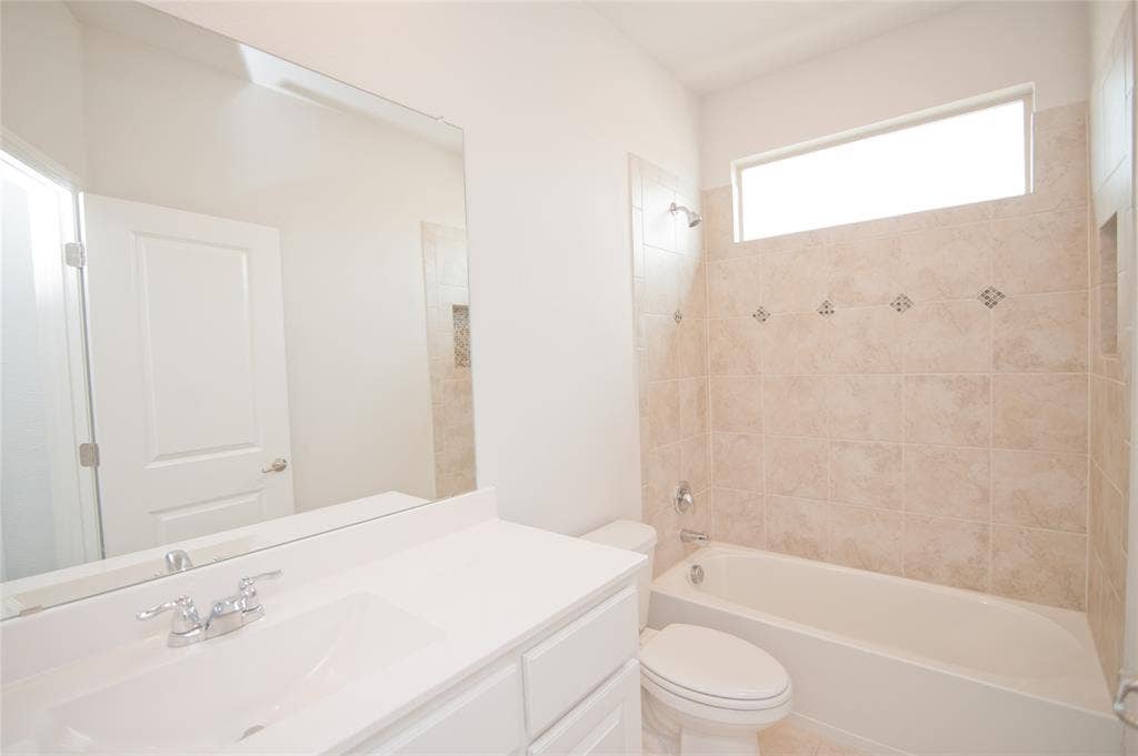 1021 Gillespie Drive, Fort Worth, TX 76247 White vanity with an integrated sink and chrome faucet