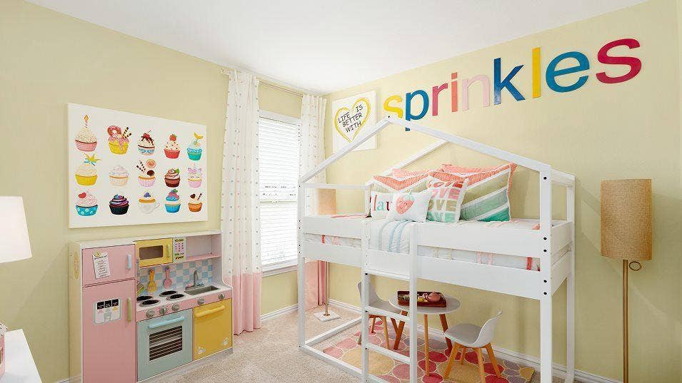 Built-in white bunk bed frame with a ladder