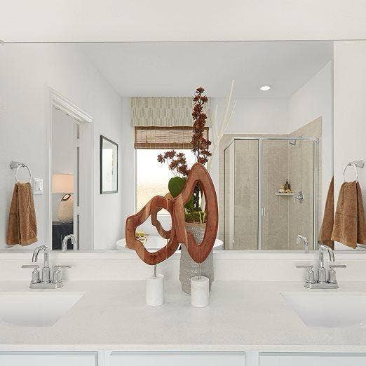 Dual vanity with undermount sinks, chrome fixtures, and a spacious countertop