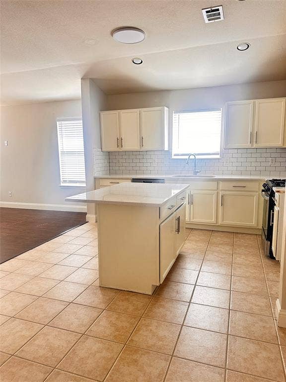 12262 PEAK Circle, Frisco, TX 75035 Kitchen with backsplash, white cabinetry, gas stove, and recessed lighting