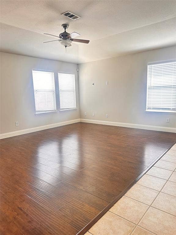 12262 PEAK Circle, Frisco, TX 75035 Spare room with dark wood-type flooring, ceiling fan, and a textured ceiling
