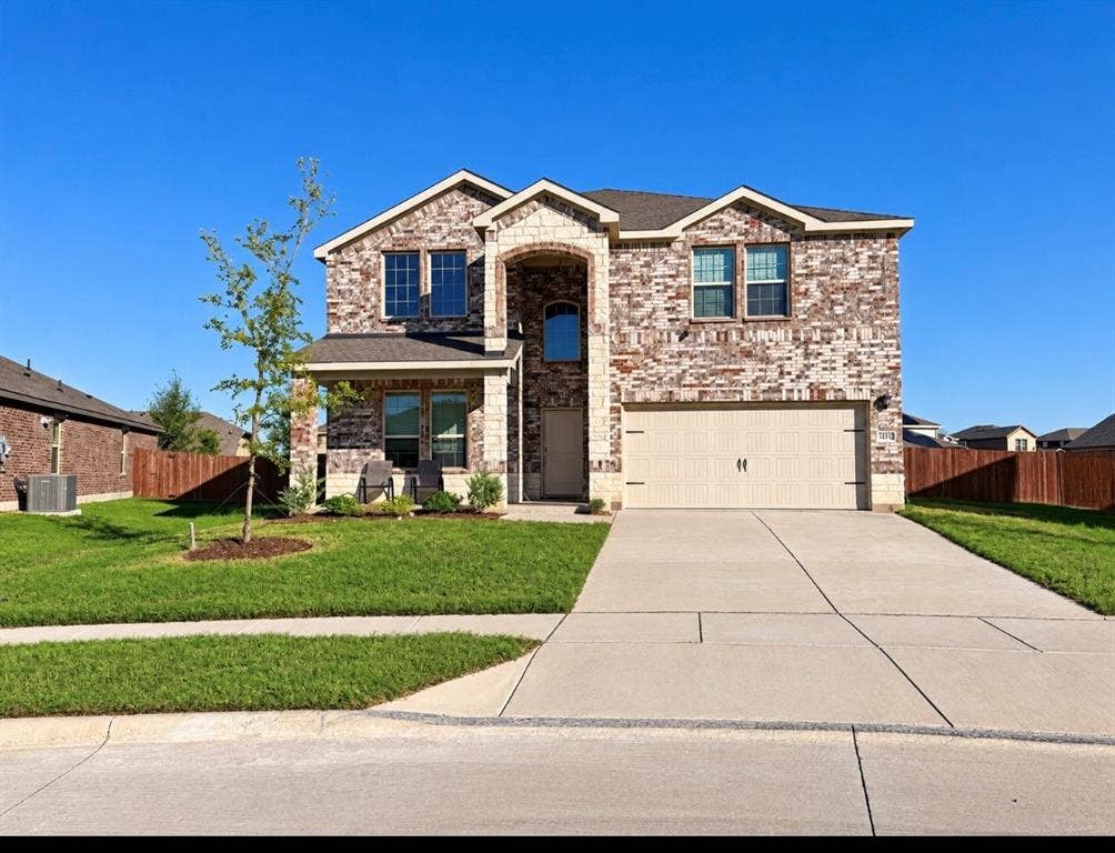 Brick and stone veneer exterior with gabled roof lines