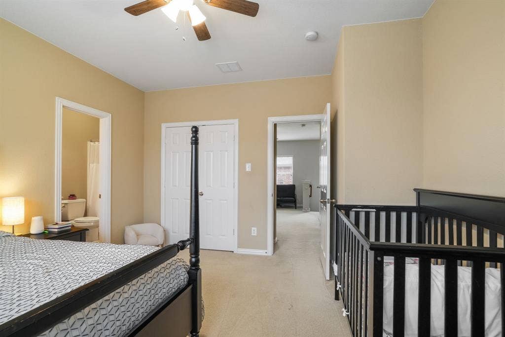 1213 Egret Court, Little Elm, TX 75068 Neutral wall tones, ceiling fan with integrated lighting, dual bi-fold closet doors, and carpeted flooring