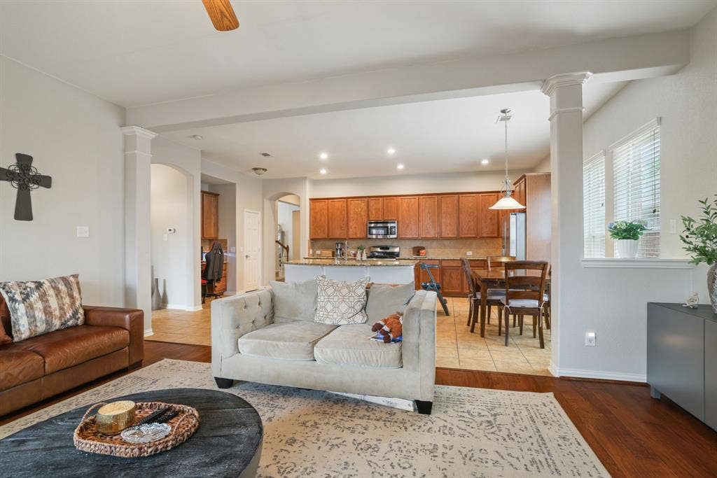 1213 Egret Court, Little Elm, TX 75068 Spacious interior with wood-finish flooring, recessed lighting, and decorative columns