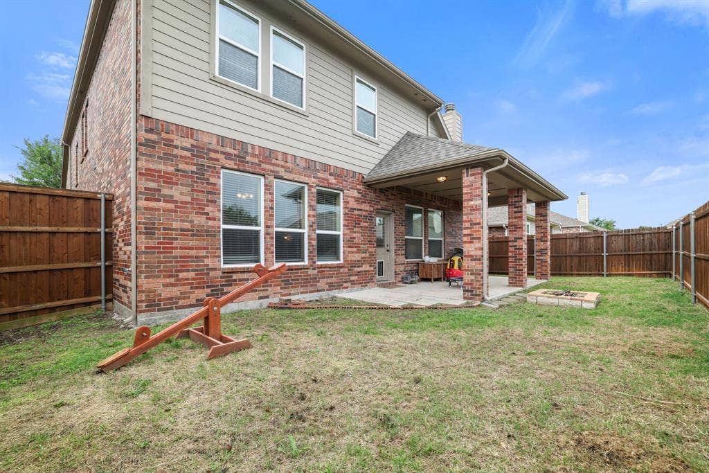 1213 Egret Court, Little Elm, TX 75068 Brick and siding exterior with multiple windows