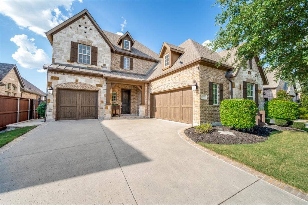 2721 Old Shire Path Road, Prosper, TX 75078 Stone and brick exterior with dormer windows