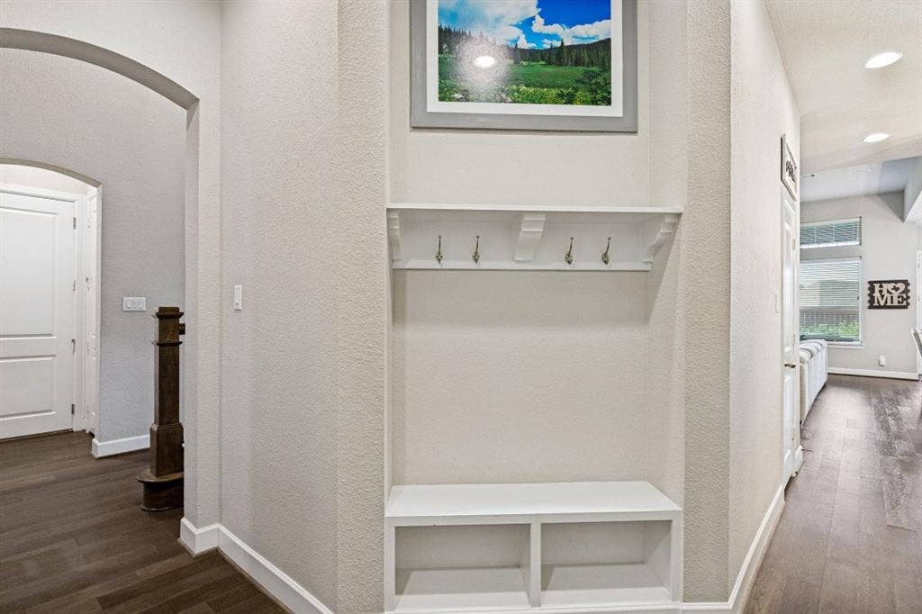 2721 Old Shire Path Road, Prosper, TX 75078 Built-in mudroom bench with shelving and coat hooks